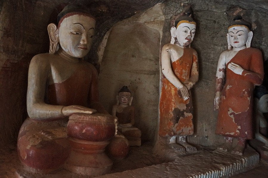 Monk and Buddha Statue inside Po Win Taung Cave complex