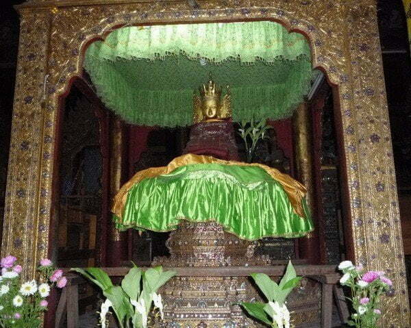 Buddha Statue on tiered throne at Jumping Cat Monastery