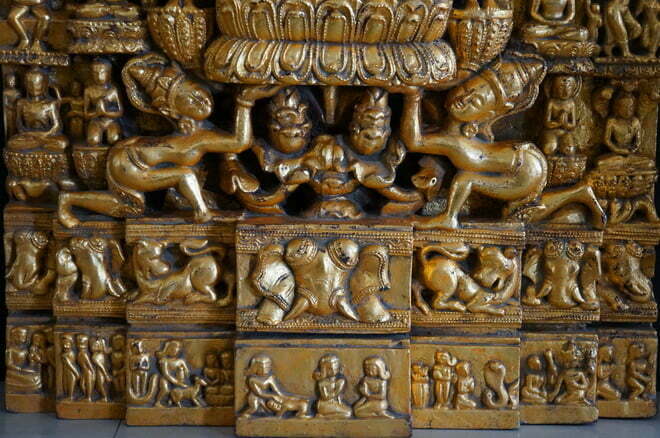 Bottom view of Burmese carving scenes from the life of Buddha