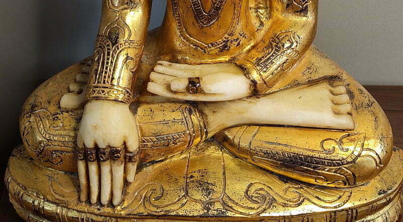Rings on fingers of Burmese Crowned Buddha Statue