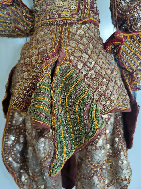 Close view of Sequins and glass beads on Burmese Garuda Puppet